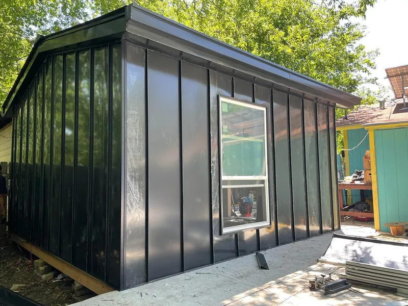 Black standing seam metal wall panels for Roof Inspection in Bridgetown